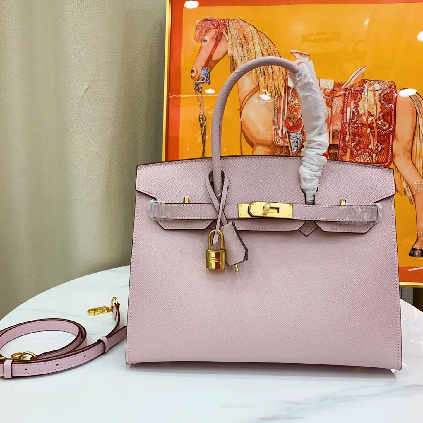 Delicate Pale Mauve Pink Fine Grain Sharp Lined Compact Trapezoid Tote With Warm Blush Rose Gold Twist Lock Hardware And Matching Tonal Suspended Padlock Charm
