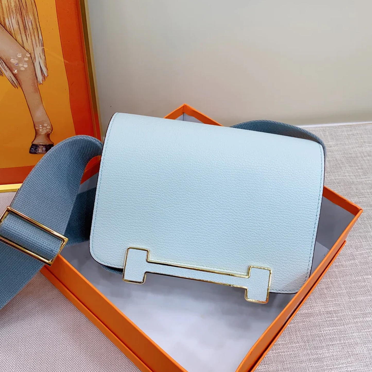 Serene Pale Mist Blue Compact Rectangular Box Pouch With Wide Woven Fabric Strap And Horizontal Framed Luminous Golden Metal Clasp