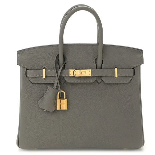 Muted Ash Grey Natural Grain Compact Structured Trapezoid Tote With Glossy Warm Golden Twist Lock Hardware And Tonal Suspended Metal Padlock Charm
