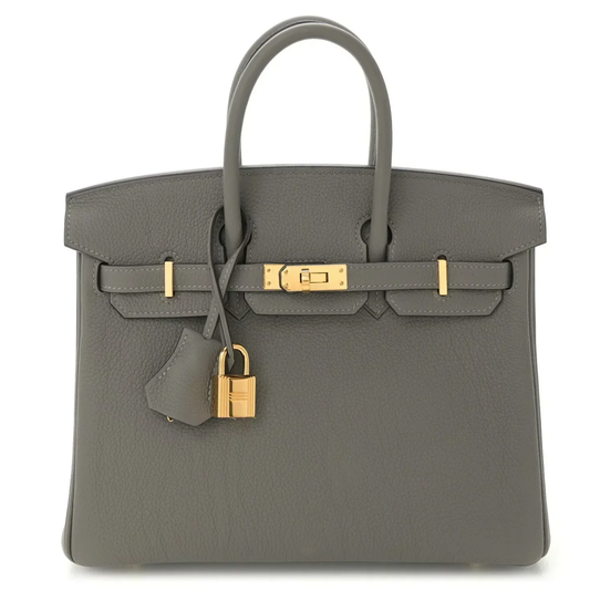 Muted Ash Grey Natural Grain Compact Structured Trapezoid Tote With Glossy Warm Golden Twist Lock Hardware And Tonal Suspended Metal Padlock Charm